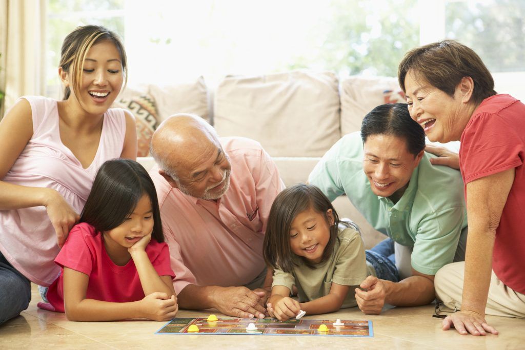 family playing board game
