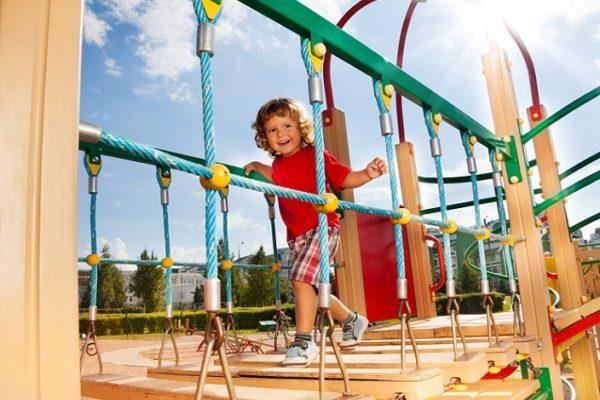 kid_running_across_playground_bridge