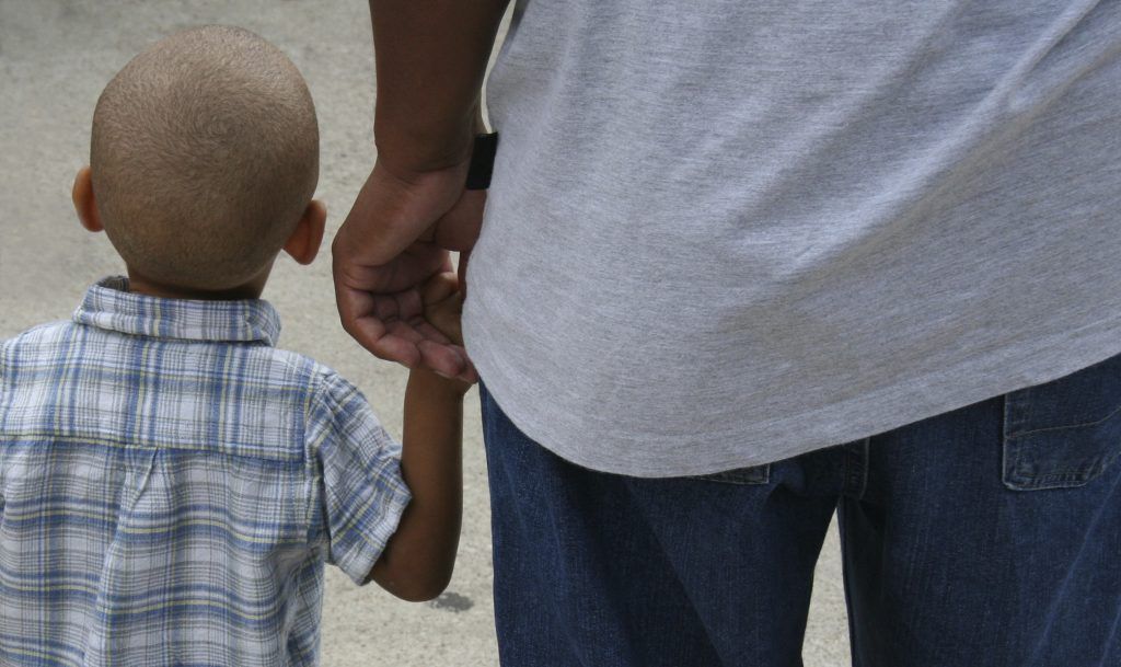 little_boy_holding_dads_hand