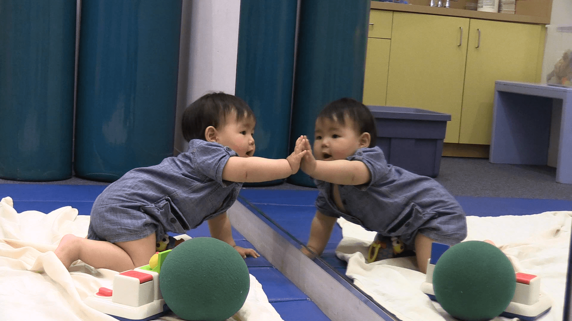 Baby Touching Mirror